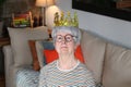 Delusional senior lady wearing a crown