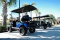 Deluxe Golf Cart in Community Parking Space Royalty Free Stock Photo