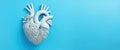 Delve into the realm of medical aesthetics with a volumetric heart mockup against a serene blue background, seamlessly