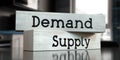 Demand, supply - words on wooden blocks