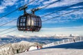 Skiers on the slope. Cableway Funitel in Low Tatras mountains, Slovakia