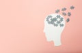 Dementia, alzheimer, memory and mental brain health concept background. Paper head with puzzle pieces on a pink Royalty Free Stock Photo