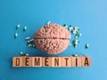 Dementia on table with and medical pills and treatment Royalty Free Stock Photo