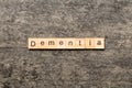 Dementia word written on wood block. Dementia text on cement table for your desing, concept Royalty Free Stock Photo