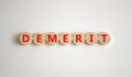 Demerit symbol. The concept word Demerit on wooden circles. Beautiful white background, copy space. Business and demerit concept
