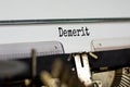 Demerit symbol. The word `demerit` typed on retro typewriter. Business, demerit concept. Beautiful white background