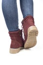 Demi-season, women`s shoes, brown, on the feet in jeans, white background, laces