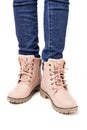 Demi-season, women`s shoes, pink, on the feet in jeans, white background, laces