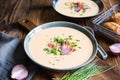 Demikat, classic Slovakian creamy sheep cheese soup topped with roasted bacon and fresh chives