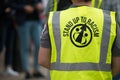 Demo steward ensures public safety at a Stand Up To Racism demonstration.