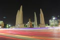 Democracy monument is circular traffic landmark at Bangkok Thailand . architecture in history . slow motion of light on street at