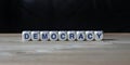 Democracy politics word on wood Royalty Free Stock Photo