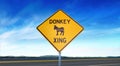 Democratic Donkey Crossing Symbol - Yellow Road Sign Isolated on Sky Background with Room for Copy