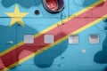 Democratic Republic of the Congo flag depicted on side part of military armored helicopter closeup. Army forces aircraft