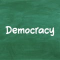 Democray handwritten on green chalkboard Royalty Free Stock Photo