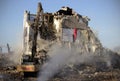 Bulldozer demolishes old historical building in Vilnius, Lithuania Royalty Free Stock Photo