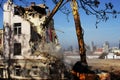 Bulldozer demolishes old soviet union building remains in Vilnius Royalty Free Stock Photo