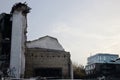 Demolished old soviet union building remains in contrast with modern building