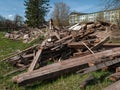 Demolished old wooden house and brick chimney on a sunny day Royalty Free Stock Photo