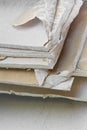 Demolished plasterboard wall, made of plaster and cardboard, with fragments of material and dust in a construction site