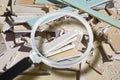 Demolished plasterboard wall, made of plaster and cardboard, with fragments of material and dust in a construction site - focus