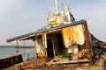 Demolished and rusty deck of a cargo ship with old bridge, mast, antennas and machinery