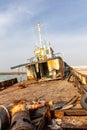 Demolished and rusty deck of a cargo ship with old bridge, mast, antennas and machinery Royalty Free Stock Photo