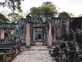 Demolished stone rock door frame at Preah Khan temple Angkor Wat complex, Siem Reap Cambodia. A popular tourist attraction nestled