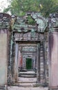 Demolished stone rock door frame at Preah Khan temple Angkor Wat complex, Siem Reap Cambodia. A popular tourist attraction nestled