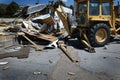 Demolishing Building Backhoe and Heavy Equipment Royalty Free Stock Photo