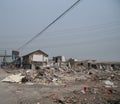 Demolishing site with ruined buildings and heaps of debris