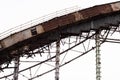 Demolition of the arena. Old metal frame of the building, destroyed walls.