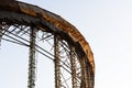 Demolition of the arena. Old metal frame of the building, destroyed walls.