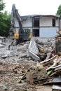 Demolition of a building in deconstruction site with debris, remains and ruined walls