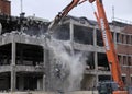 Demolition crane on old building