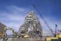 A demolition crew tearing down remnants from a bui