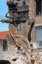 Demolition grapple of an excavator on a construction site during