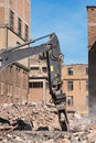 Demolition grapple of an excavator on a construction site during