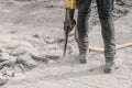 Demolition hammer. Male working in construction industry. Repairing and building a new road. Royalty Free Stock Photo