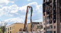 Demolition of a high-rise building. The collapse of a residential building. Construction work on the demolition of multi-storey Royalty Free Stock Photo