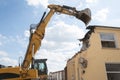 Demolition of a house by an excavator