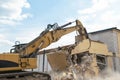 Demolition of a house by an excavator