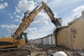 Demolition of a house by an excavator