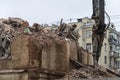 Demolition of a multi-storey building with hydraulic shears, for future development of residential buildings Royalty Free Stock Photo