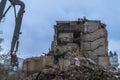 Demolition of a multi-storey building with hydraulic shears, for future development of residential buildings Royalty Free Stock Photo