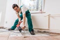 Demolition of old tiles with jackhammer. Renovation of old floor Royalty Free Stock Photo