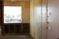Demolition of paneling off interior wall