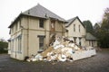 Demolition in progress of derelict house on construction building site Royalty Free Stock Photo