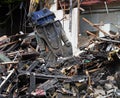 Demolition shear working on dismantling a destroyed house Royalty Free Stock Photo