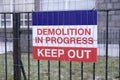 Demolition Sign on Fence at Construction Building Site Entrance